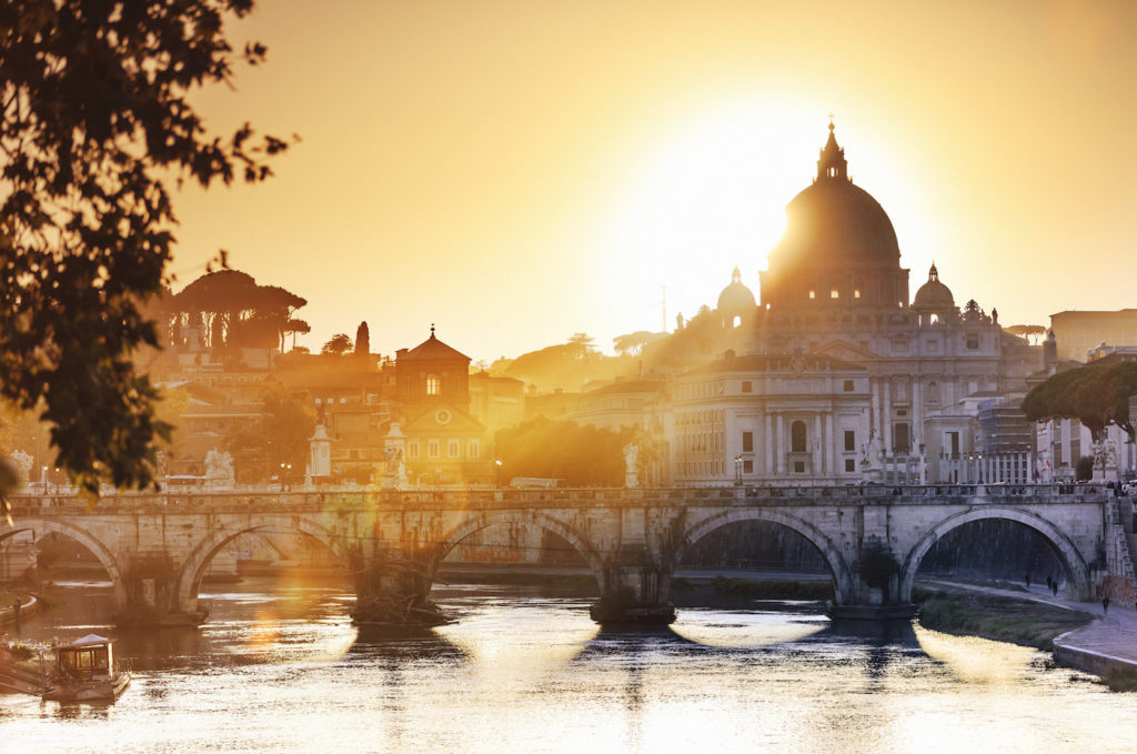 Sun setting beyond St. Peter Basilica